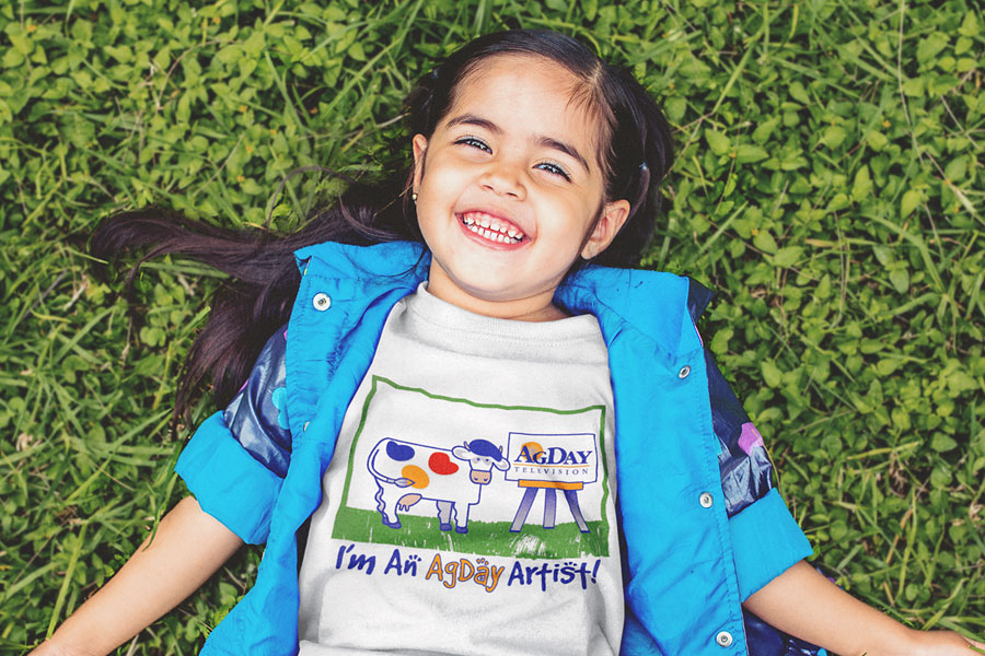 young girl wearing AgDay artist t-shirt